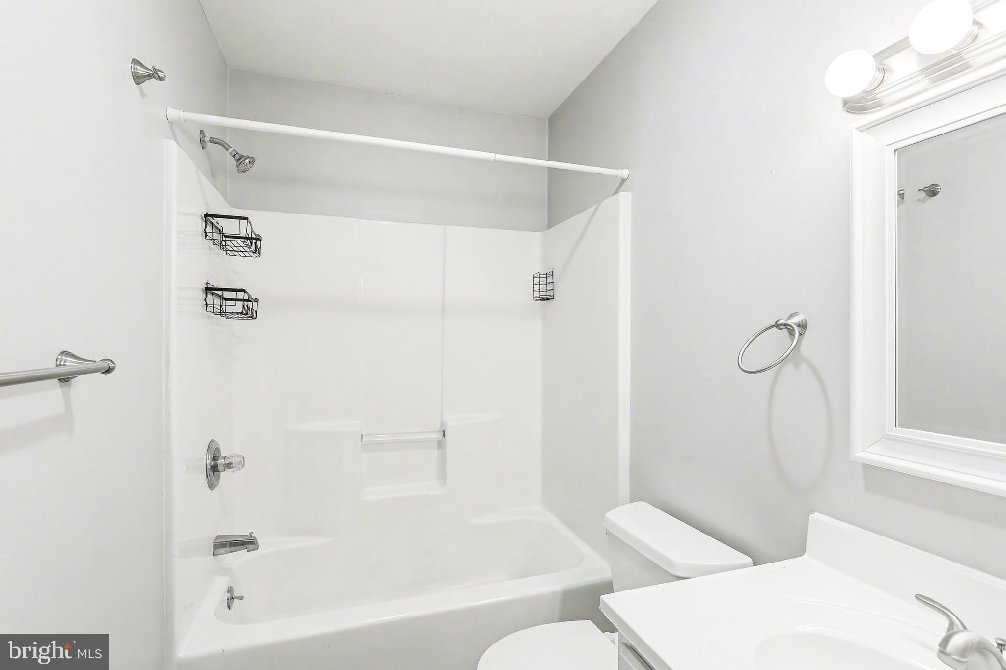 143 15th Street, Unit 3 New Cumberland, PA 17070 - Photo 7 of 10 a bathroom with a shower and a toilet