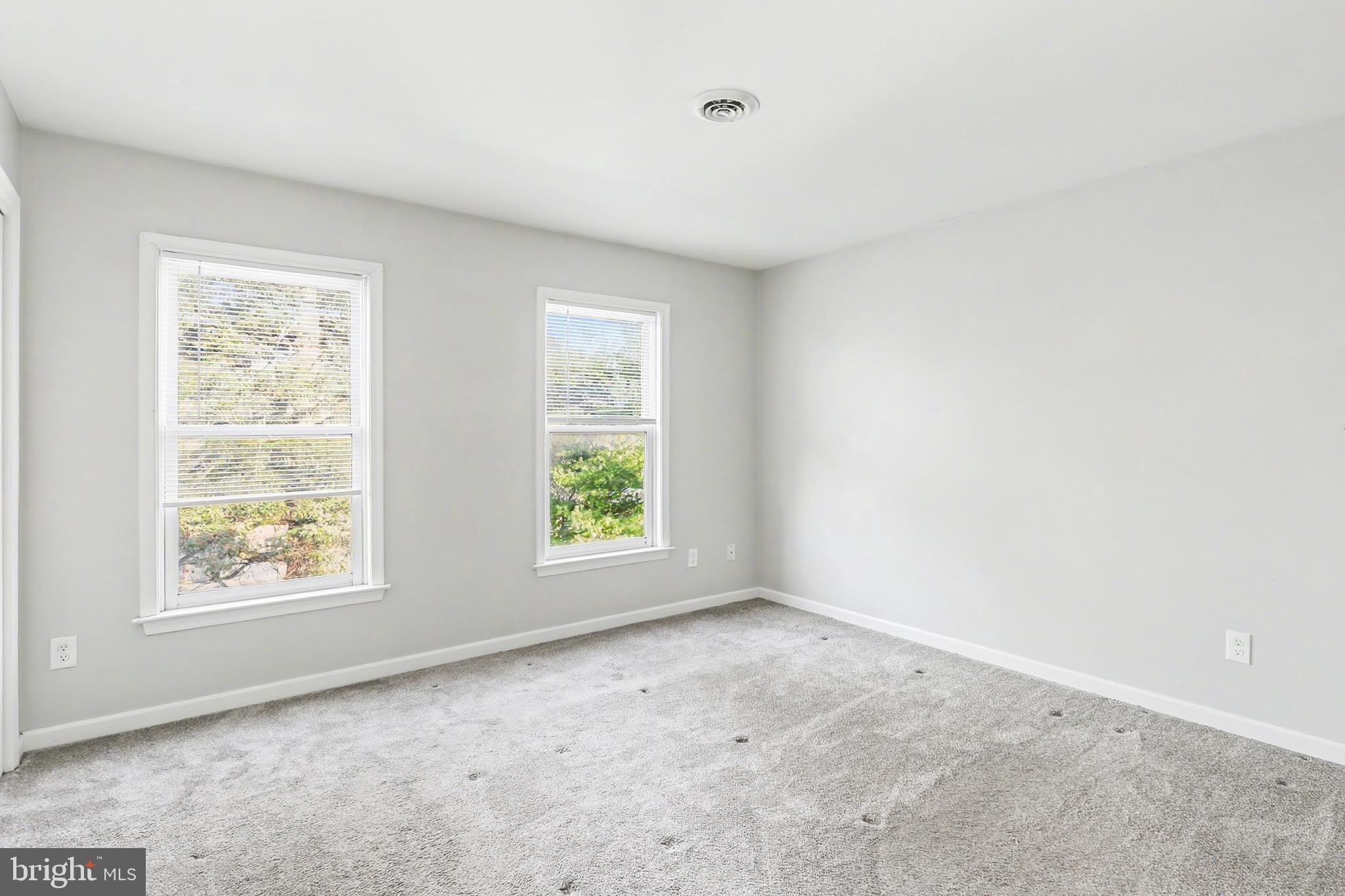 143 15th Street, Unit 3 New Cumberland, PA 17070 - Photo 8 of 10 an empty room with windows