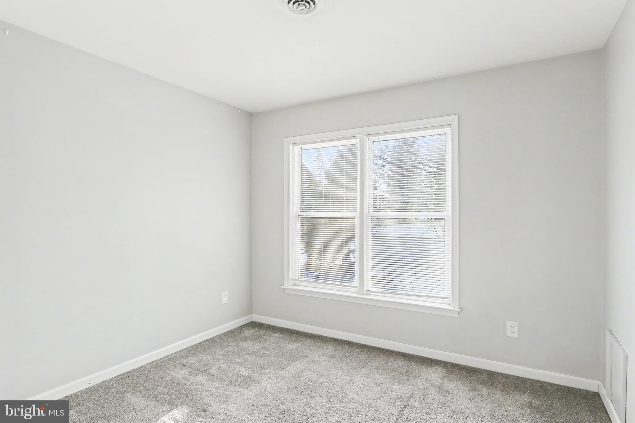 143 15th Street, Unit 3 New Cumberland, PA 17070 - Photo 9 of 10 an empty room with windows