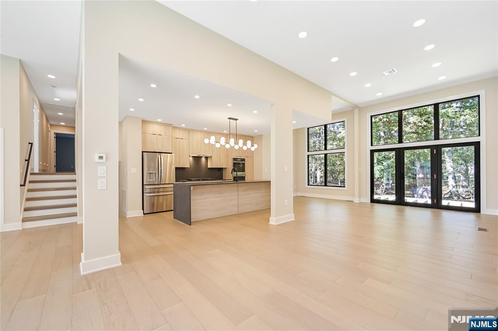 314 Meadowbrook Road Wyckoff, NJ 07481 - Photo 13 of 22 a view of an empty room with kitchen view and a window