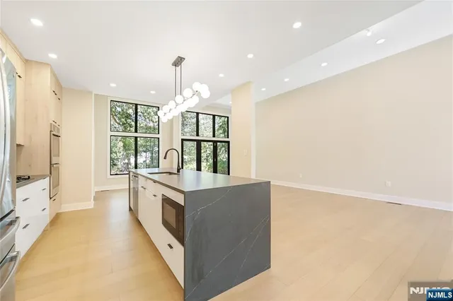 a bedroom with a bed and large window