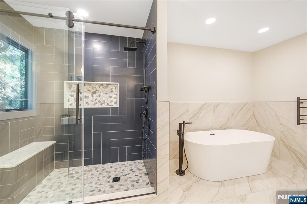 314 Meadowbrook Road Wyckoff, NJ 07481 - Photo 22 of 22 a bathroom with a bathtub and shower