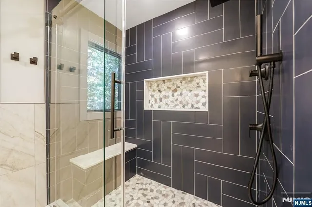 a bathroom with 2 sink and a mirror