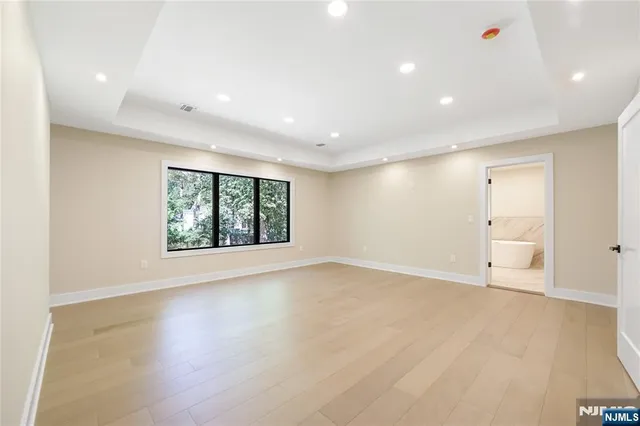 a bathroom with a double vanity sink mirror and shower