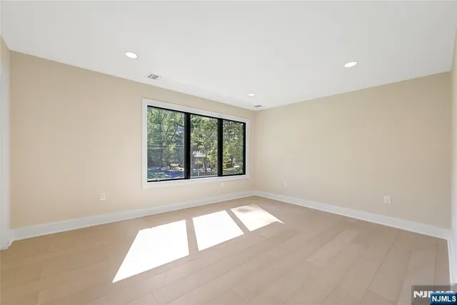 a bathroom with a glass shower door