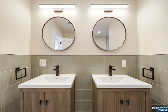 a view of a hallway with wooden floor and windows
