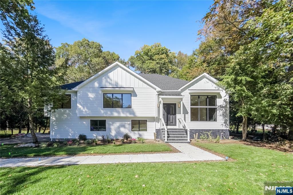 314 Meadowbrook Road Wyckoff, NJ 07481 - Photo 4 of 22 a front view of a house with a yard