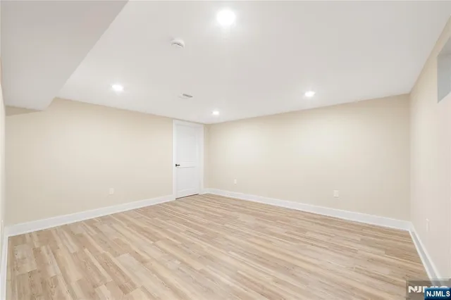 a view of closet and wooden floor