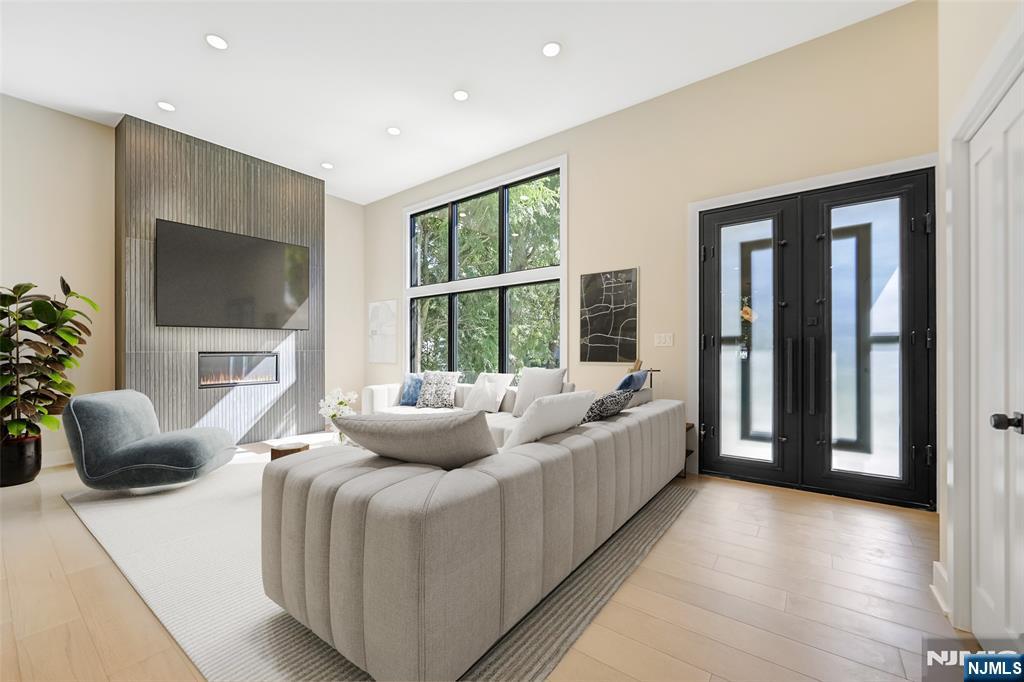 314 Meadowbrook Road Wyckoff, NJ 07481 - Photo 9 of 22 a living room with furniture and a flat screen tv