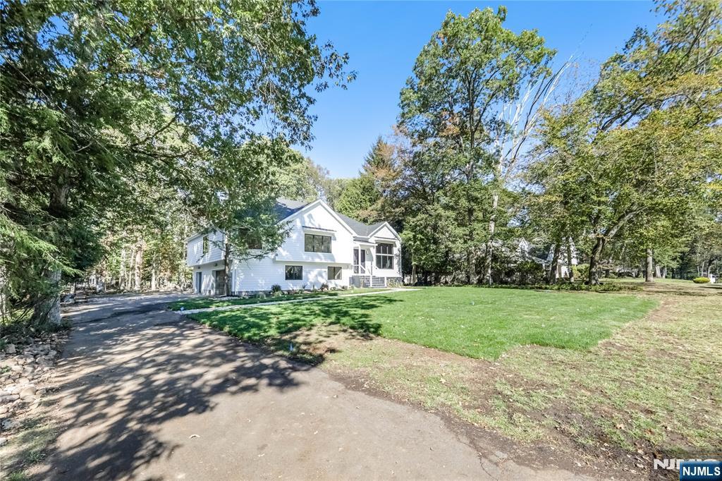 314 Meadowbrook Road Wyckoff, NJ 07481 - Photo 10 of 22 a view of a large garden with plants and large trees