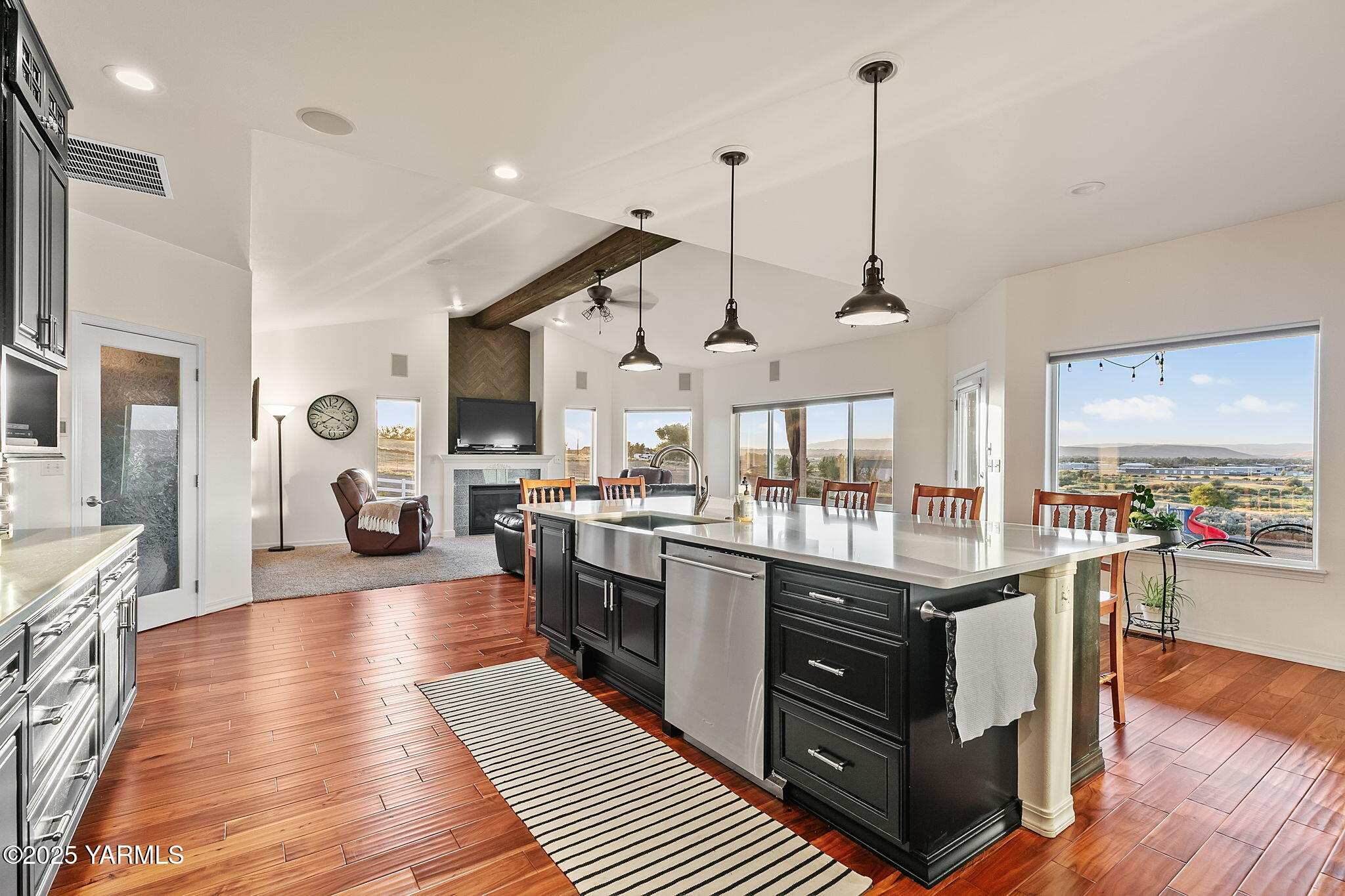 3431 Goodman Road Union Gap, WA 98903 - Photo 11 of 26 a open kitchen with stainless steel appliances granite countertop a stove and cabinets