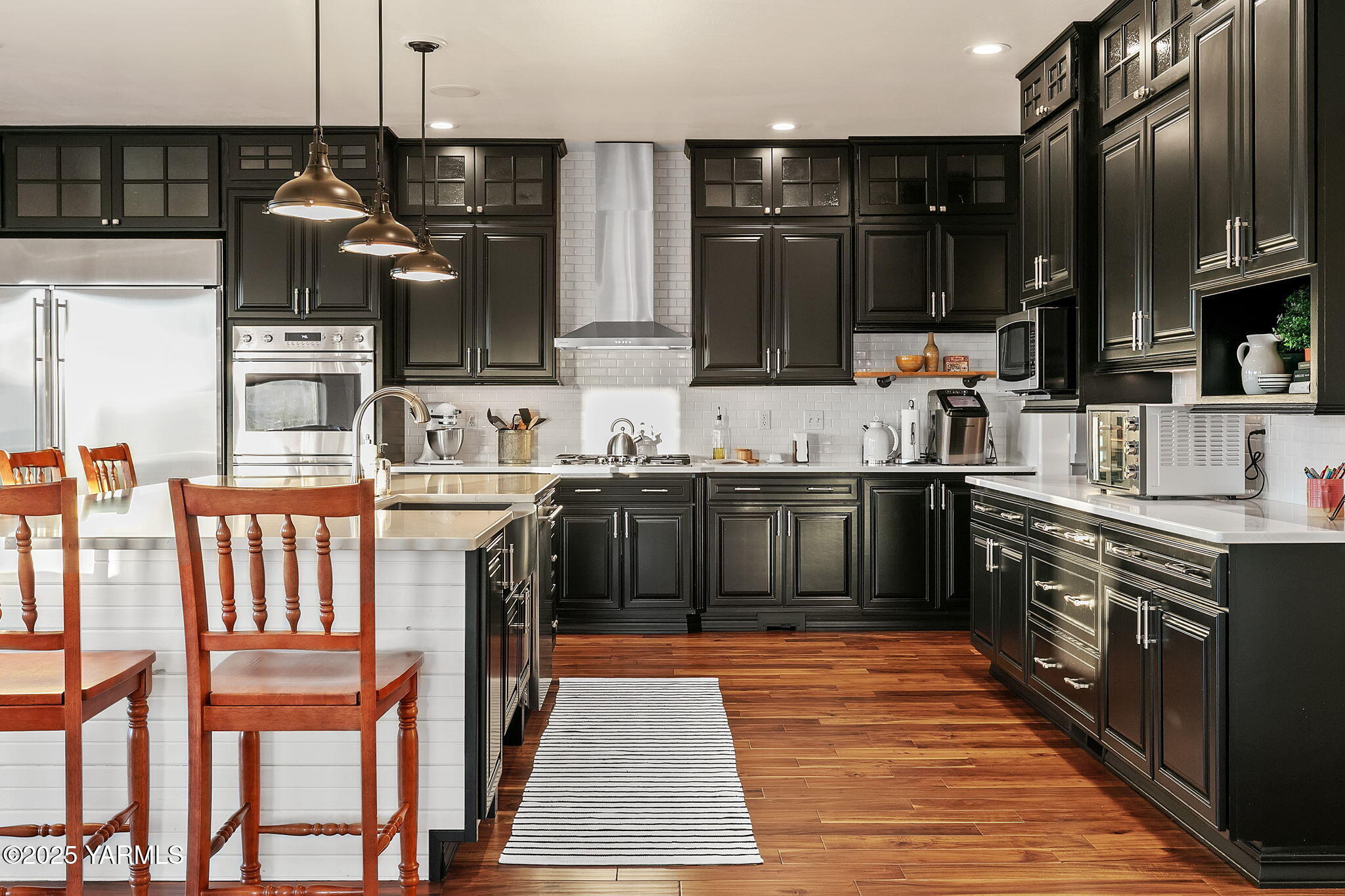 3431 Goodman Road Union Gap, WA 98903 - Photo 12 of 26 a kitchen with stainless steel appliances granite countertop a sink a stove and a refrigerator