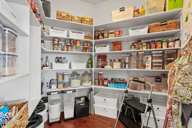 a work place with a book shelf and a shelf