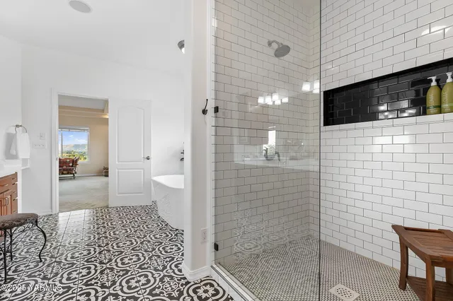 a bathroom with a sink a toilet a shower and bathtub