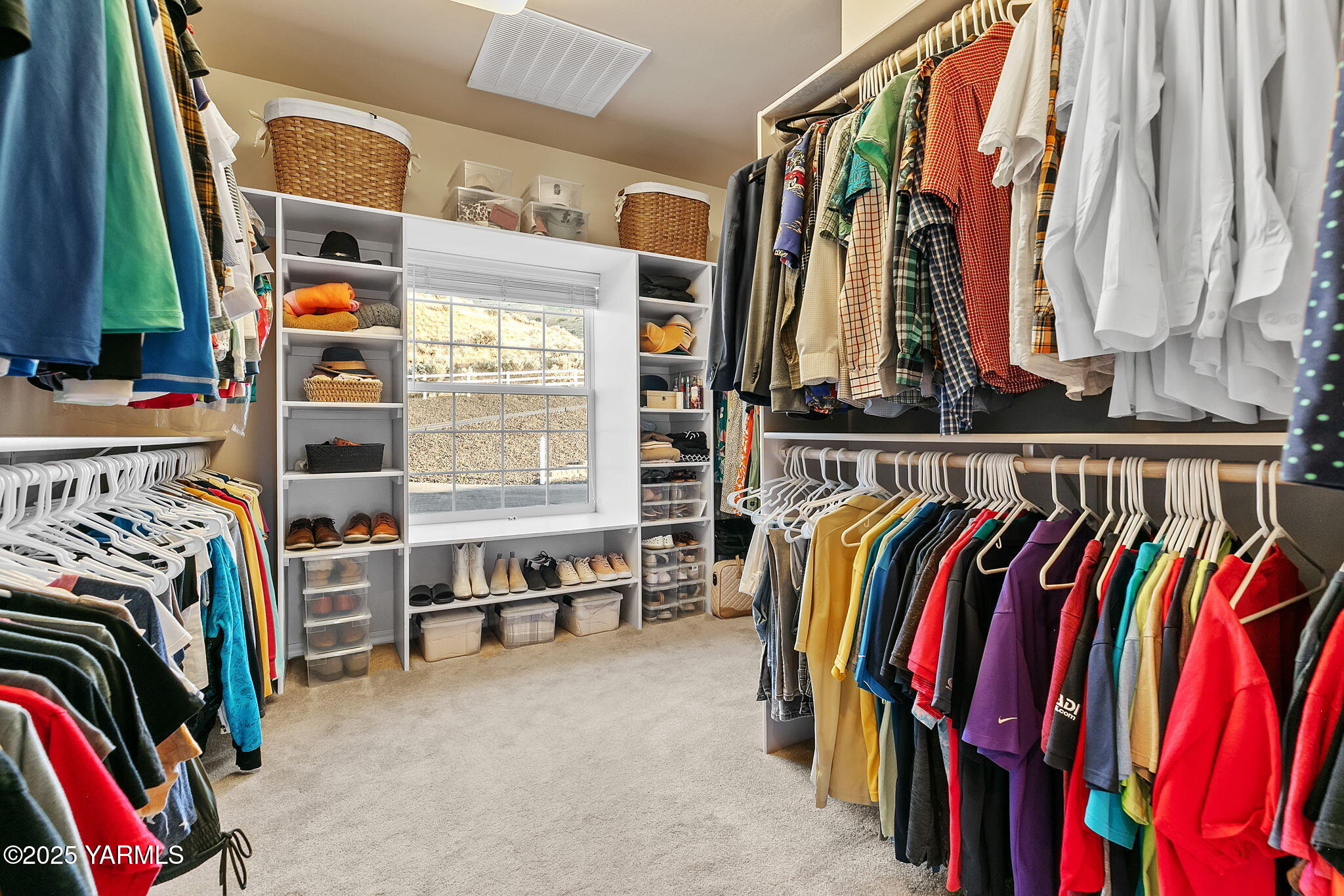 3431 Goodman Road Union Gap, WA 98903 - Photo 16 of 26 a view of walk in closet with clothes and shoes