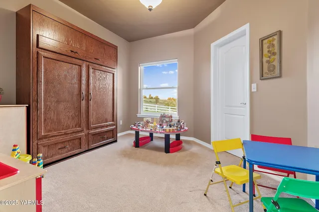 a bedroom with furniture and a window