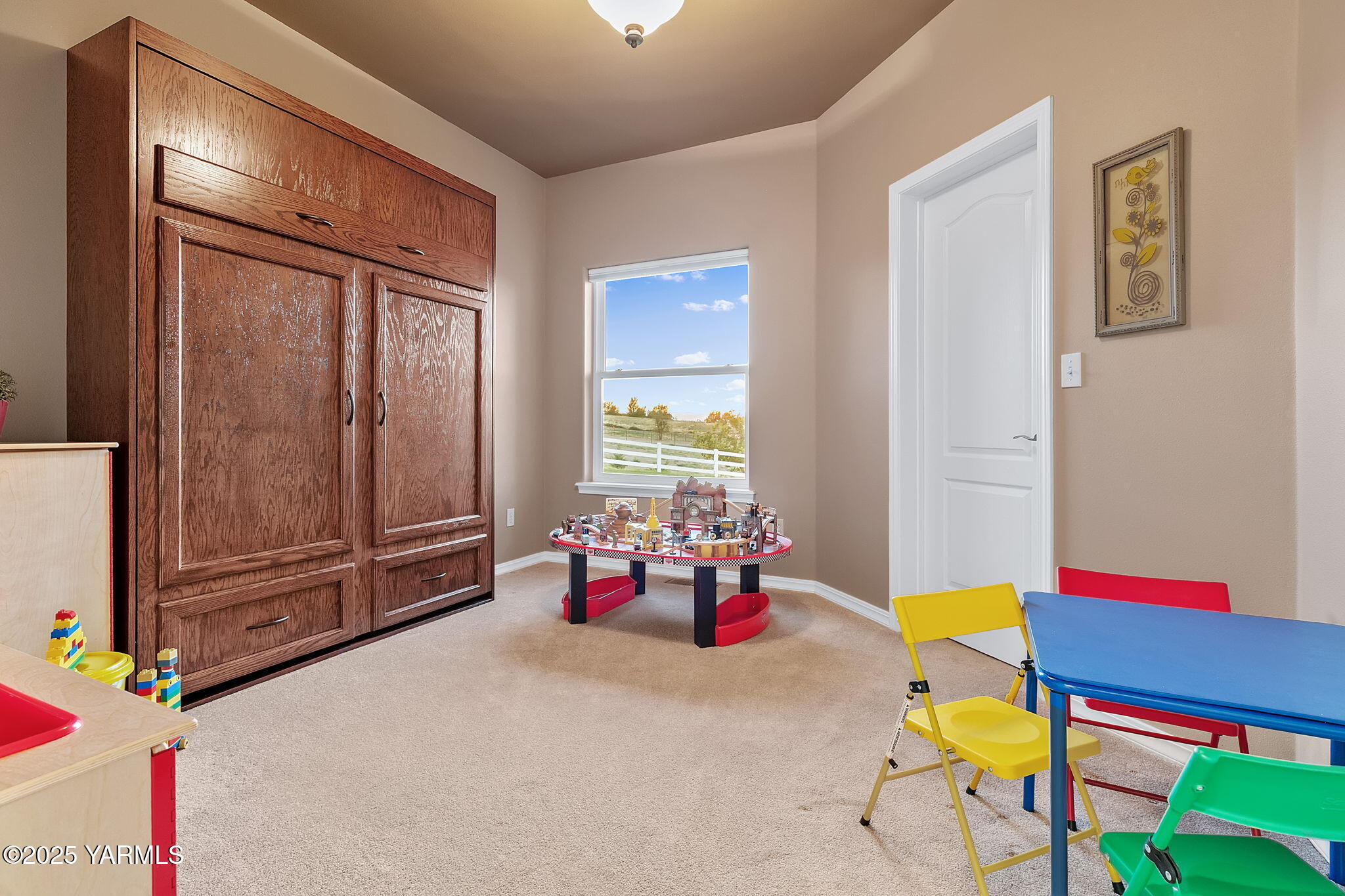 3431 Goodman Road Union Gap, WA 98903 - Photo 17 of 26 a bedroom with furniture and a window