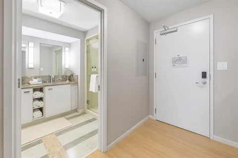a view of kitchen cabinets and wooden floor