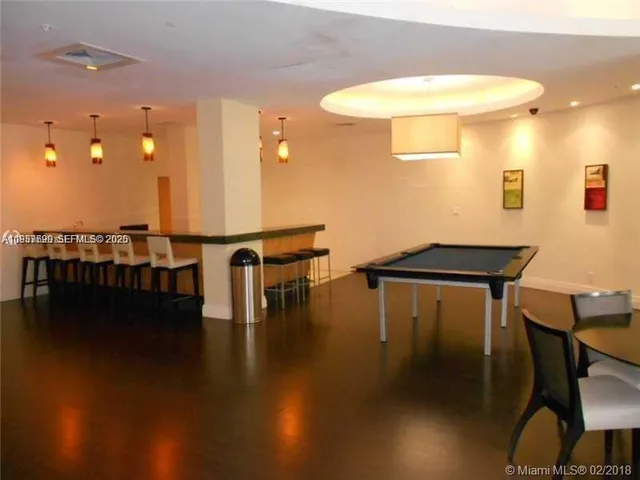 a view of a patio with table and chairs