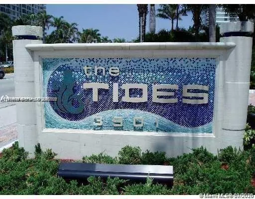 a media room with lots of chairs and a flat screen tv