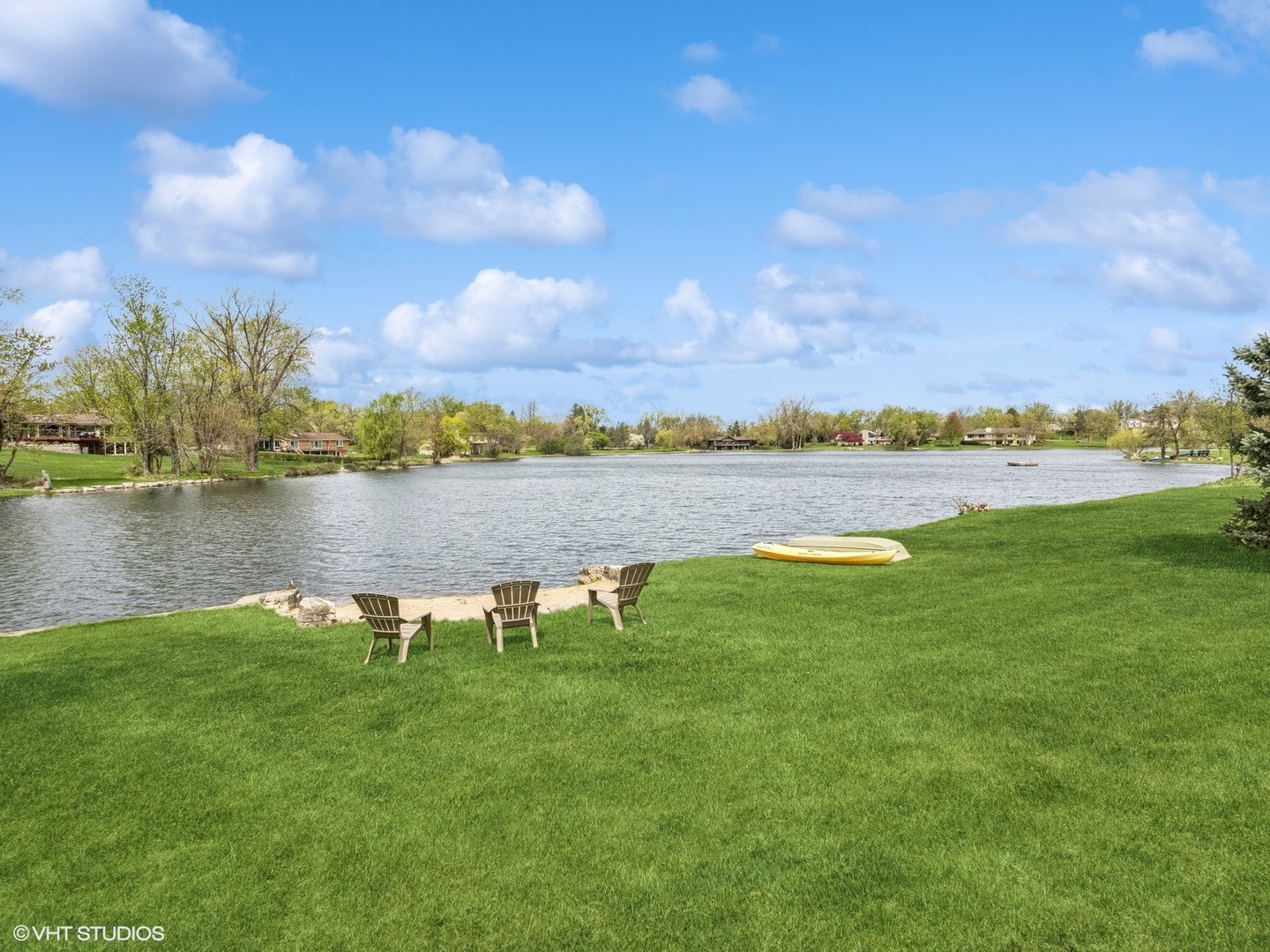 202 East Hillside Road Barrington, IL 60010 - Photo 8 of 33 a view of a lake with houses in the back
