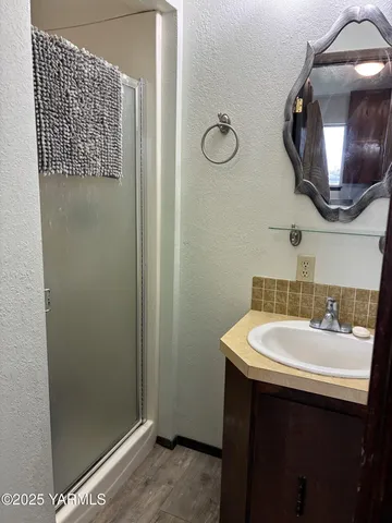 a bathroom with a sink and a mirror