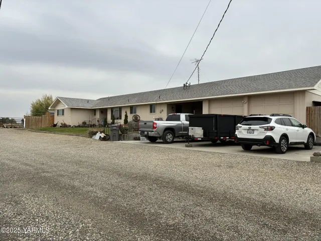 a view of parking space with parked cars