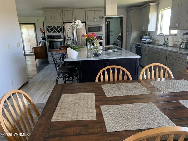 a view of a dining room with furniture and window