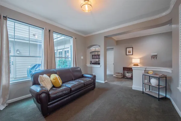 a white bath tub sitting in a bathroom and shower