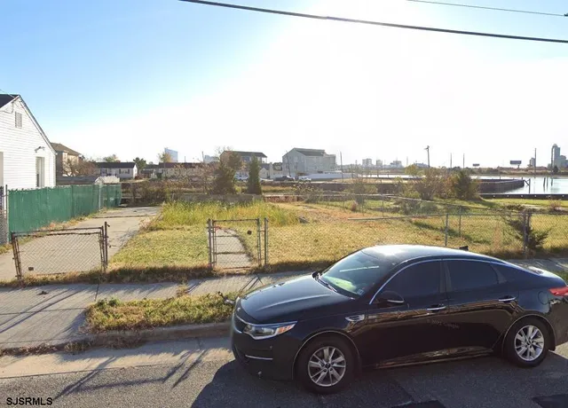 a view of a car parked in front of a house