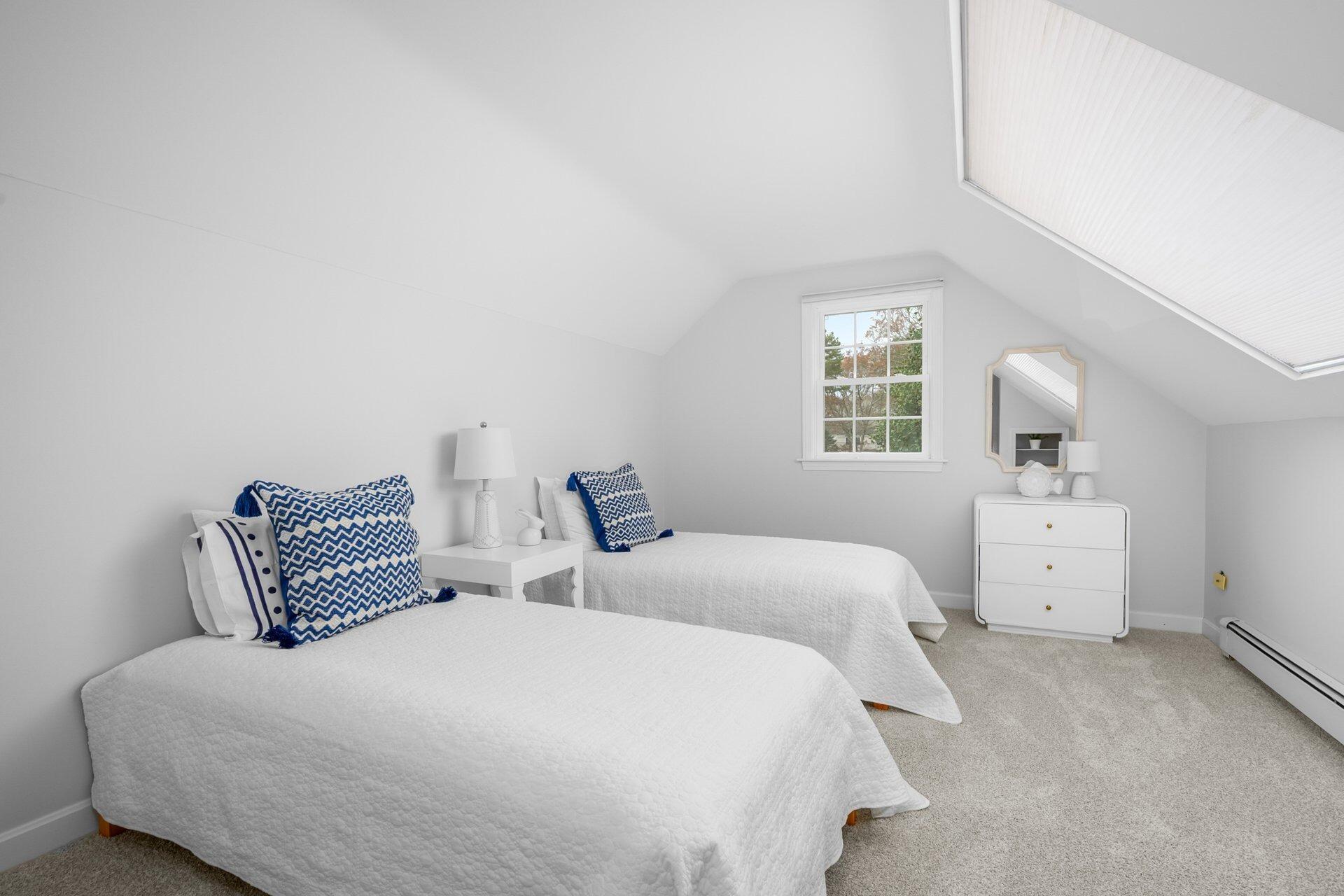 239 Clamshell Cove Road Cotuit, MA 02635 - Photo 22 of 30 a bedroom with a bed and window