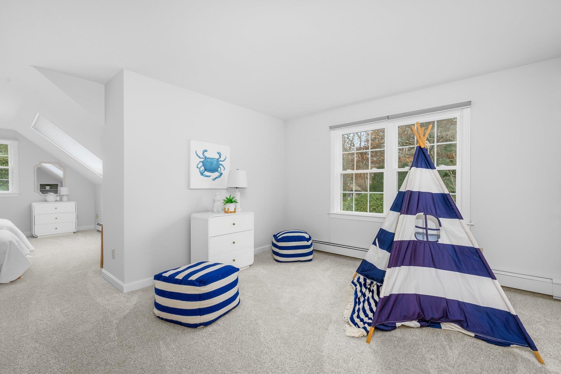 239 Clamshell Cove Road Cotuit, MA 02635 - Photo 23 of 30 a room with furniture and window