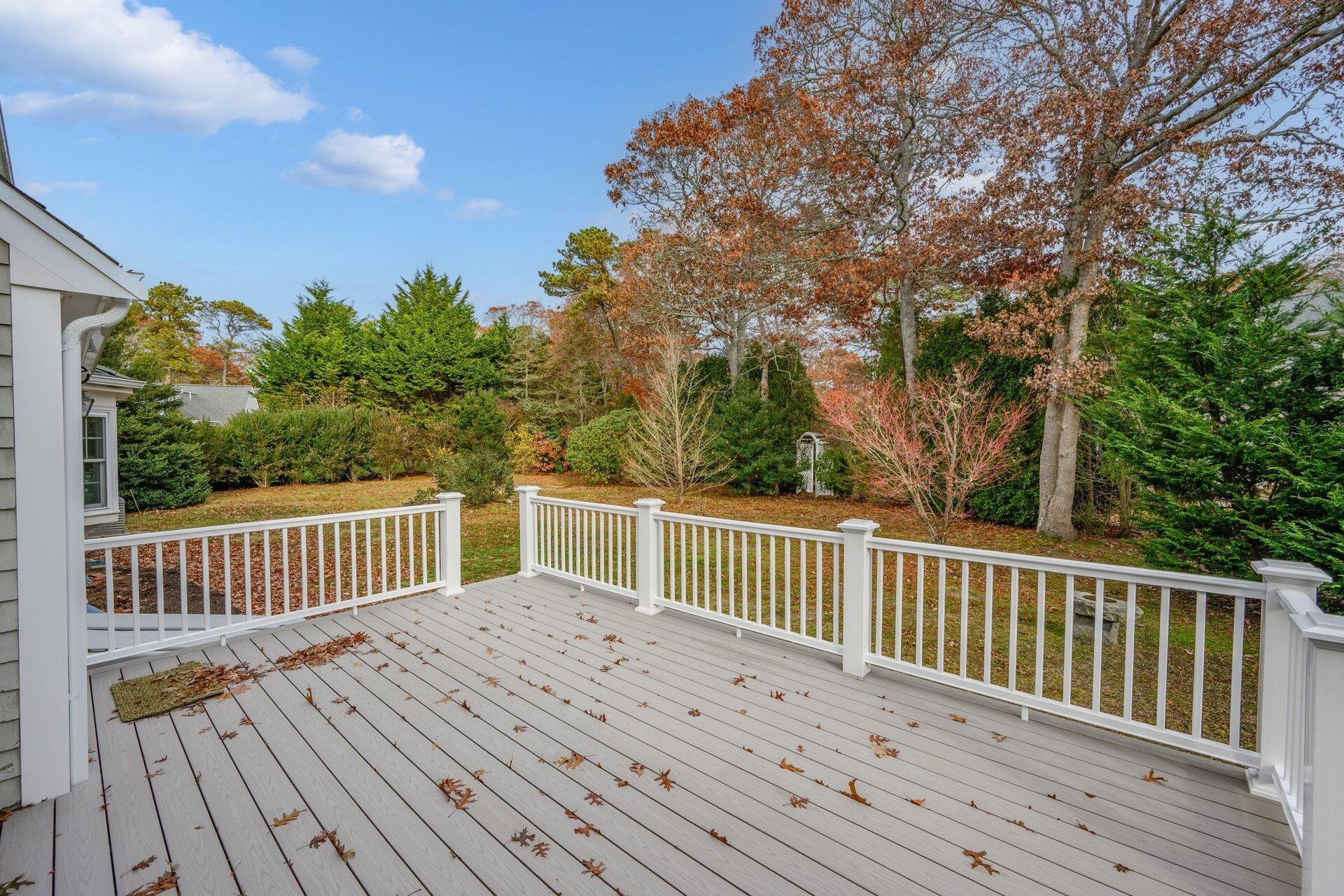 239 Clamshell Cove Road Cotuit, MA 02635 - Photo 24 of 30 a view of balcony with wooden floor and fence