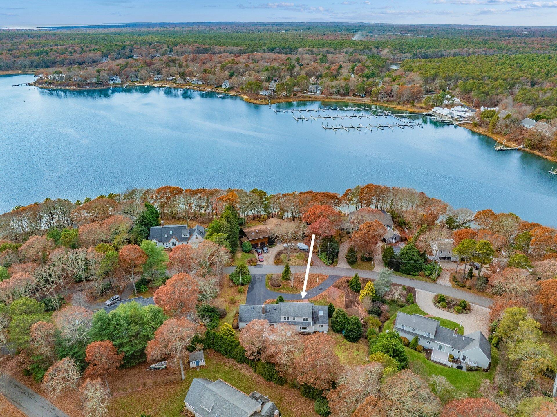 239 Clamshell Cove Road Cotuit, MA 02635 - Photo 25 of 30 an aerial view of ocean and residential houses with outdoor space