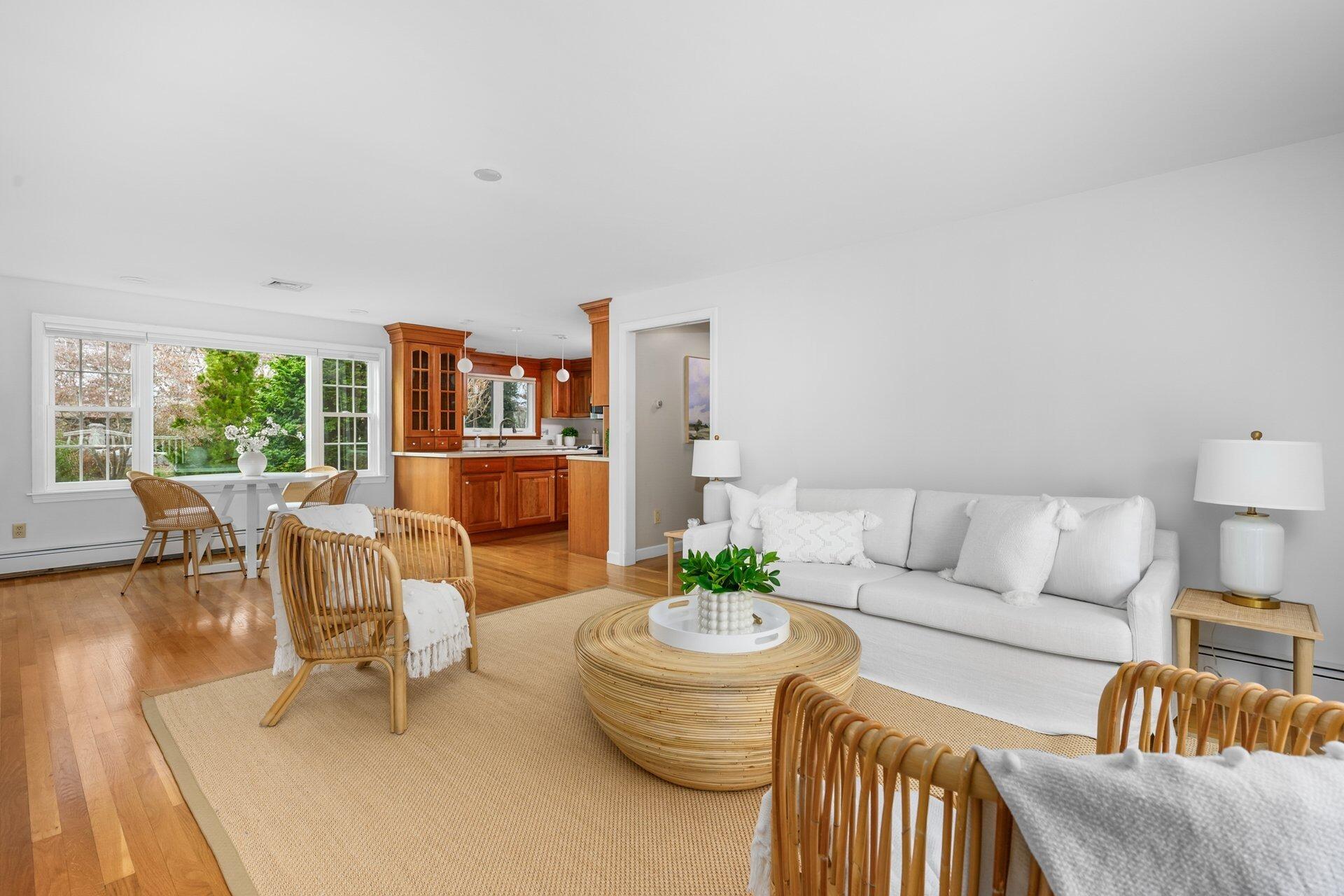 239 Clamshell Cove Road Cotuit, MA 02635 - Photo 4 of 30 a living room with furniture and a large window