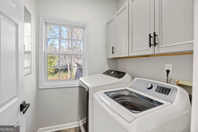 a utility room with dryer and washer