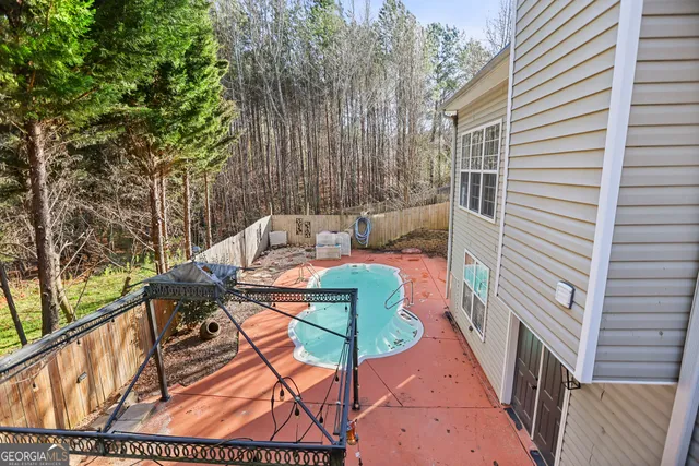 a view of an outdoor sitting area with brick walls