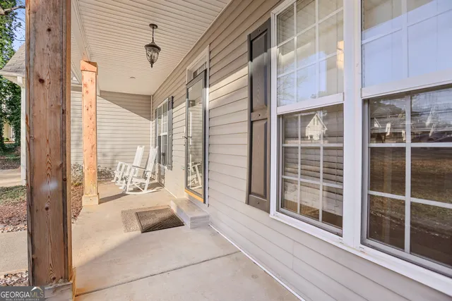 a view of a porch with a floor to ceiling window