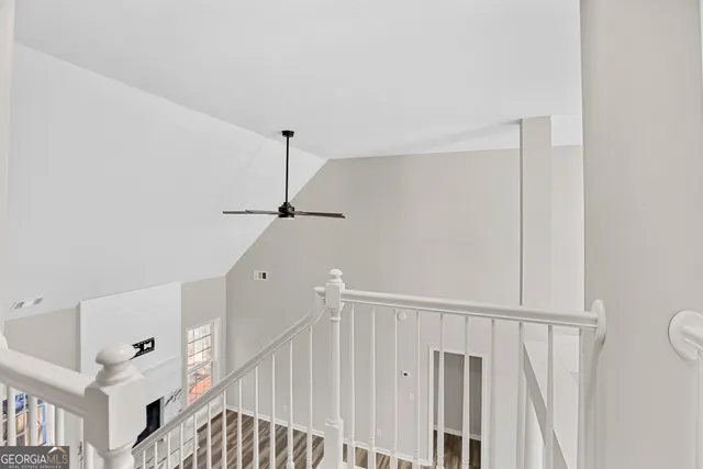 a view of staircase with white walls