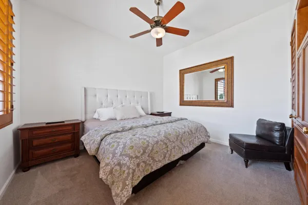 a bedroom with a bed and a couch