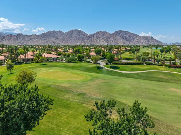 a view of a town with mountains in the background