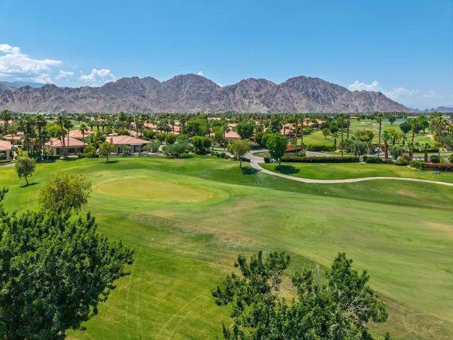 a view of a town with mountains in the background