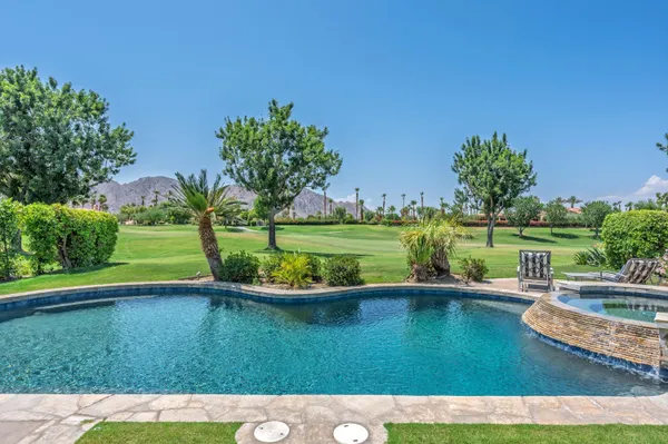 a view of a garden with a lake