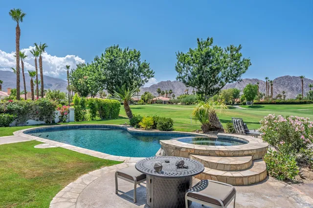 a view of a swimming pool and outdoor space