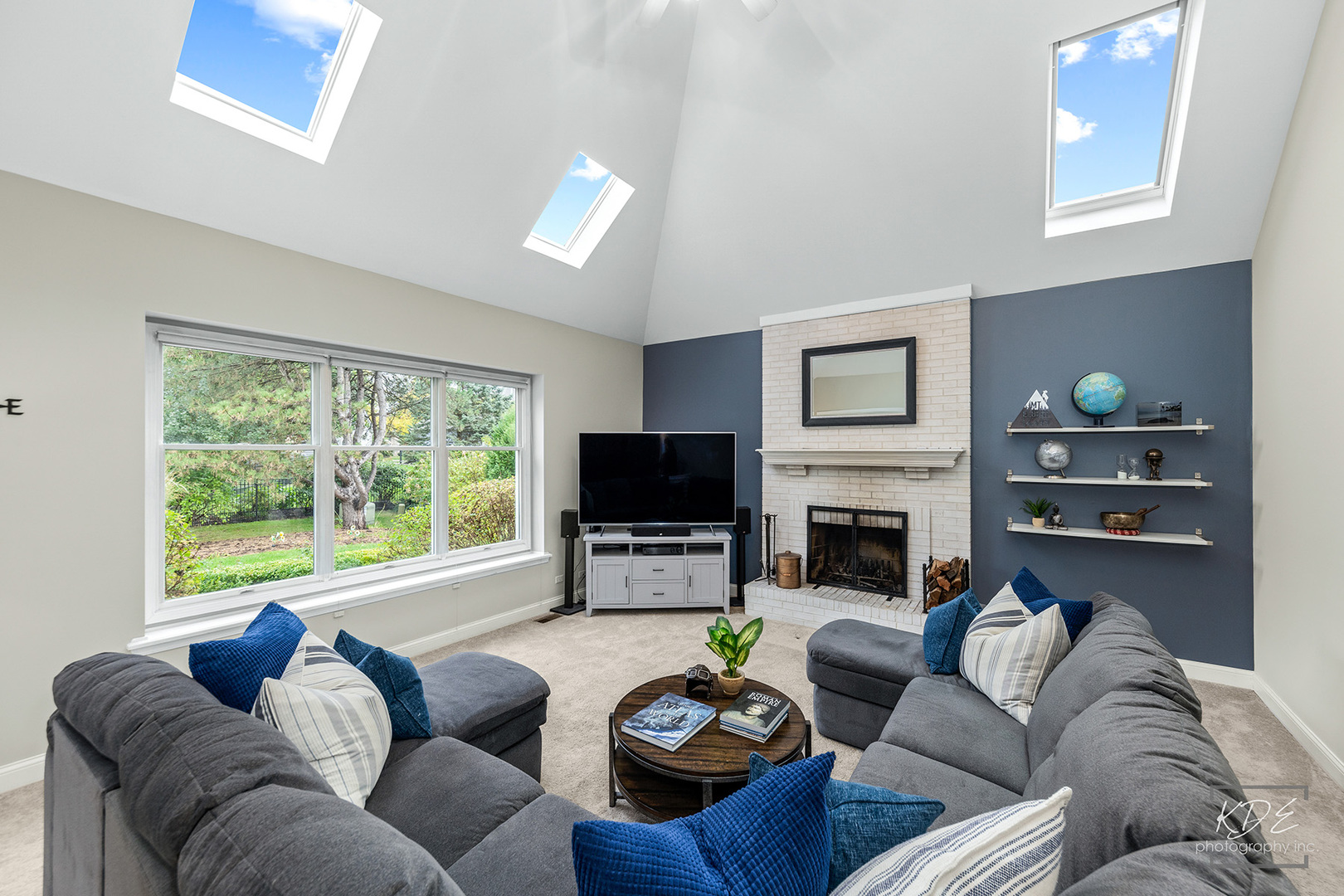 731 Gateshead Drive Naperville, IL 60565 - Photo 19 of 51 a living room with furniture a fireplace and a large window
