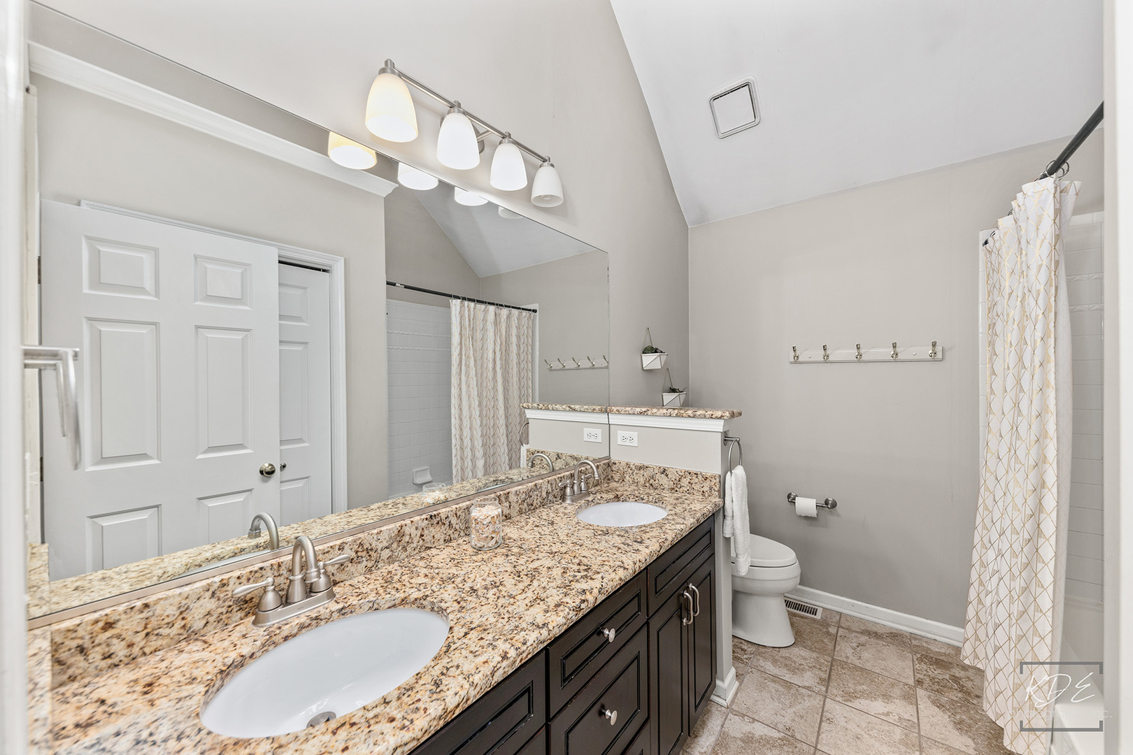 731 Gateshead Drive Naperville, IL 60565 - Photo 29 of 51 a bathroom with a granite countertop sink a toilet and a mirror