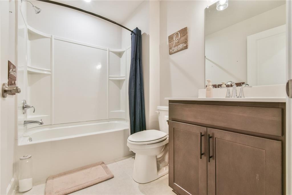 5051 Adler Court Hoschton, GA 30548 - Photo 26 of 41 a bathroom with a sink a toilet and shower