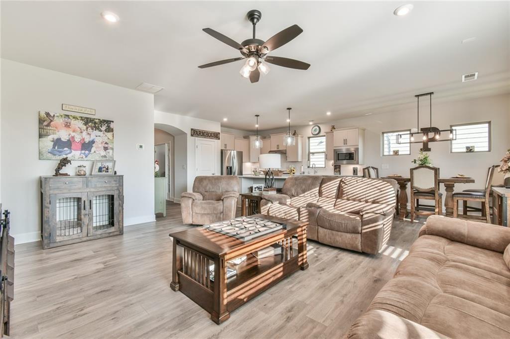 5051 Adler Court Hoschton, GA 30548 - Photo 4 of 41 a living room with furniture and a fireplace