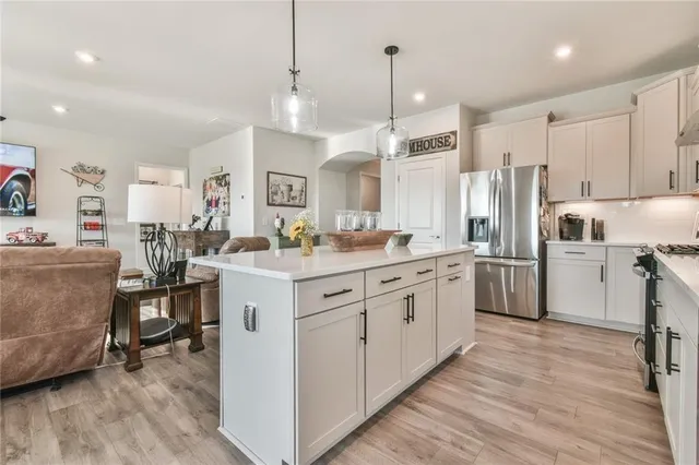 a bedroom with a large bed and a large window