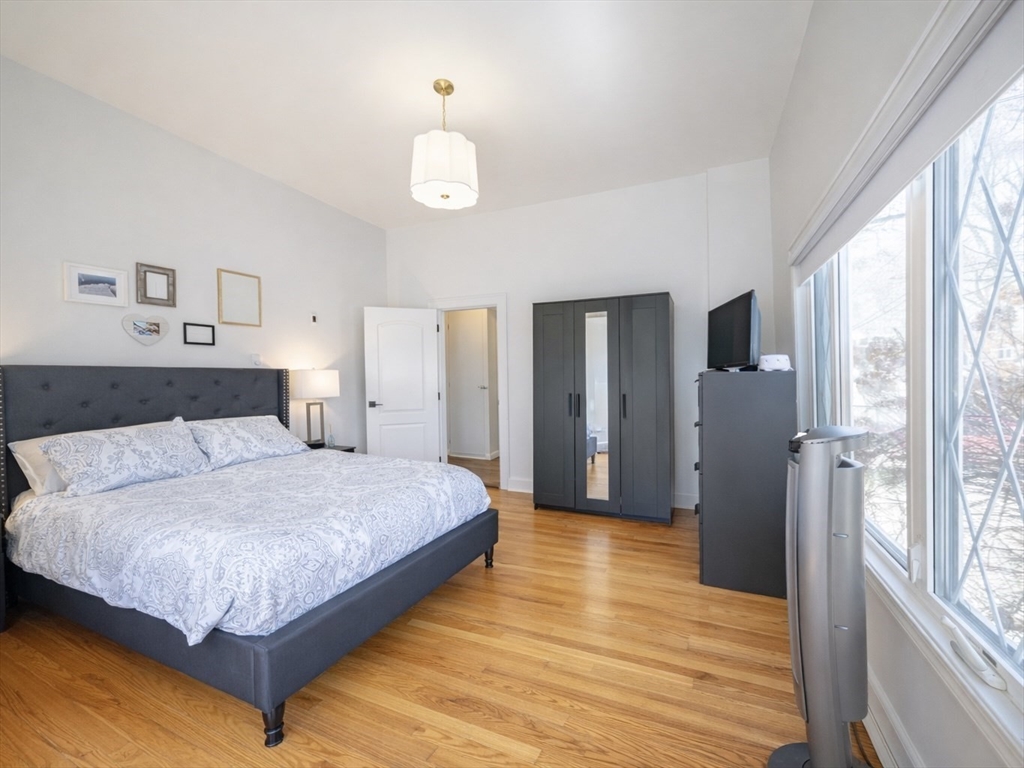 10 Guild Road Saugus, MA 01906 - Photo 18 of 32 a spacious bedroom with a bed and a large window